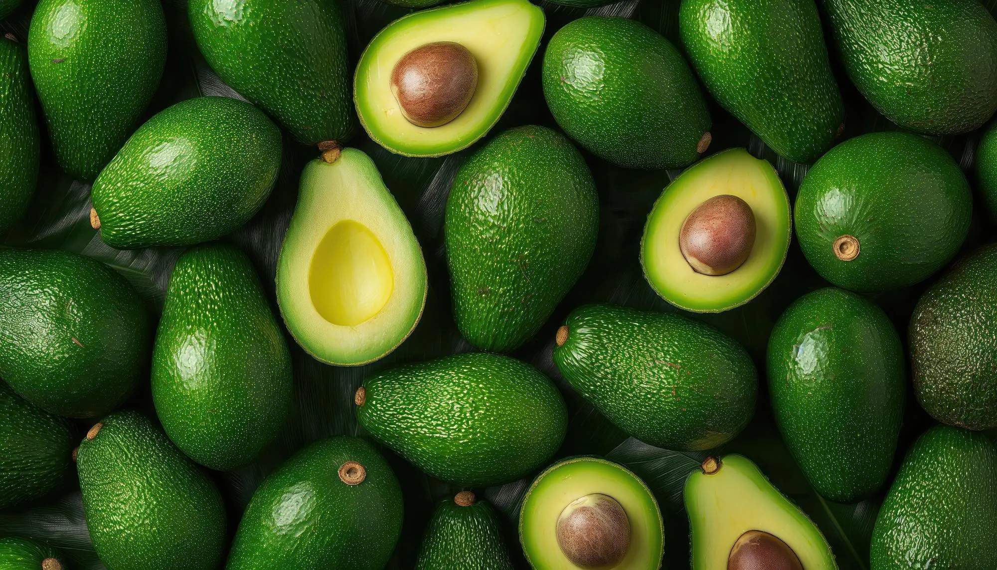 Fresh Moroccan avocados, whole and halved